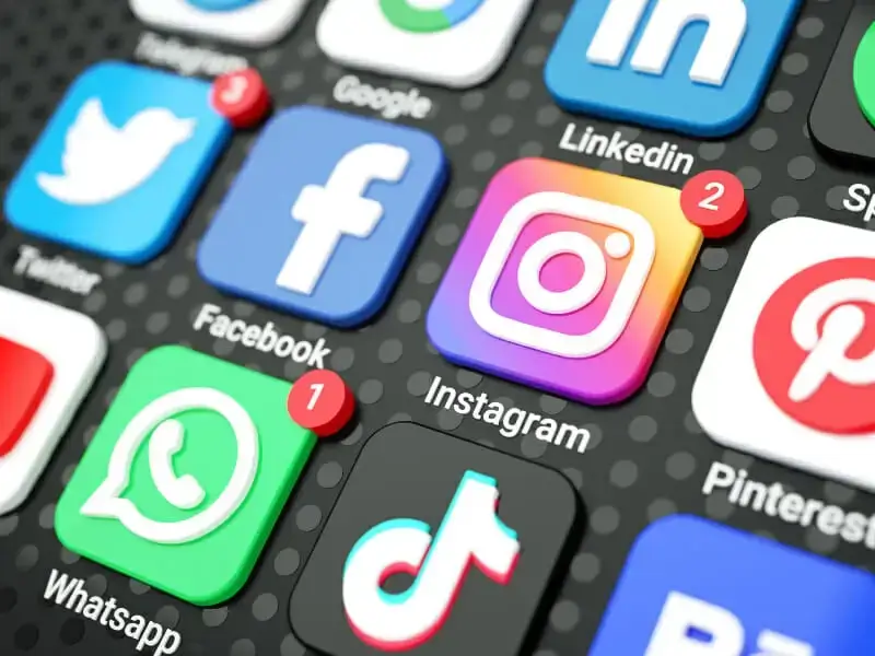 square_4_media Close-up of smartphone screen displaying various social media app icons, including Twitter, Facebook, Instagram, WhatsApp, TikTok, LinkedIn, and Pinterest, with notification badges. media_agency square_4_media Close-up of smartphone screen displaying various social media app icons, including Twitter, Facebook, Instagram, WhatsApp, TikTok, LinkedIn, and Pinterest, with notification badges. media_agency